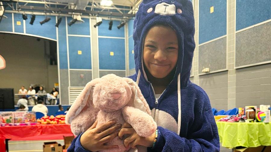 A child with a Christmas ToyMania gift